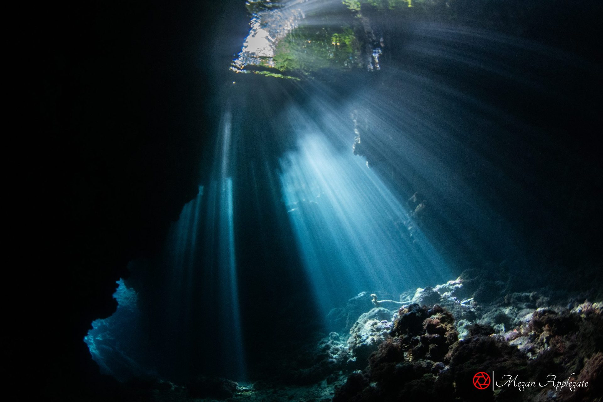 Shafts of sunlight falling into the cavern at Leru Cut, Russell Islands